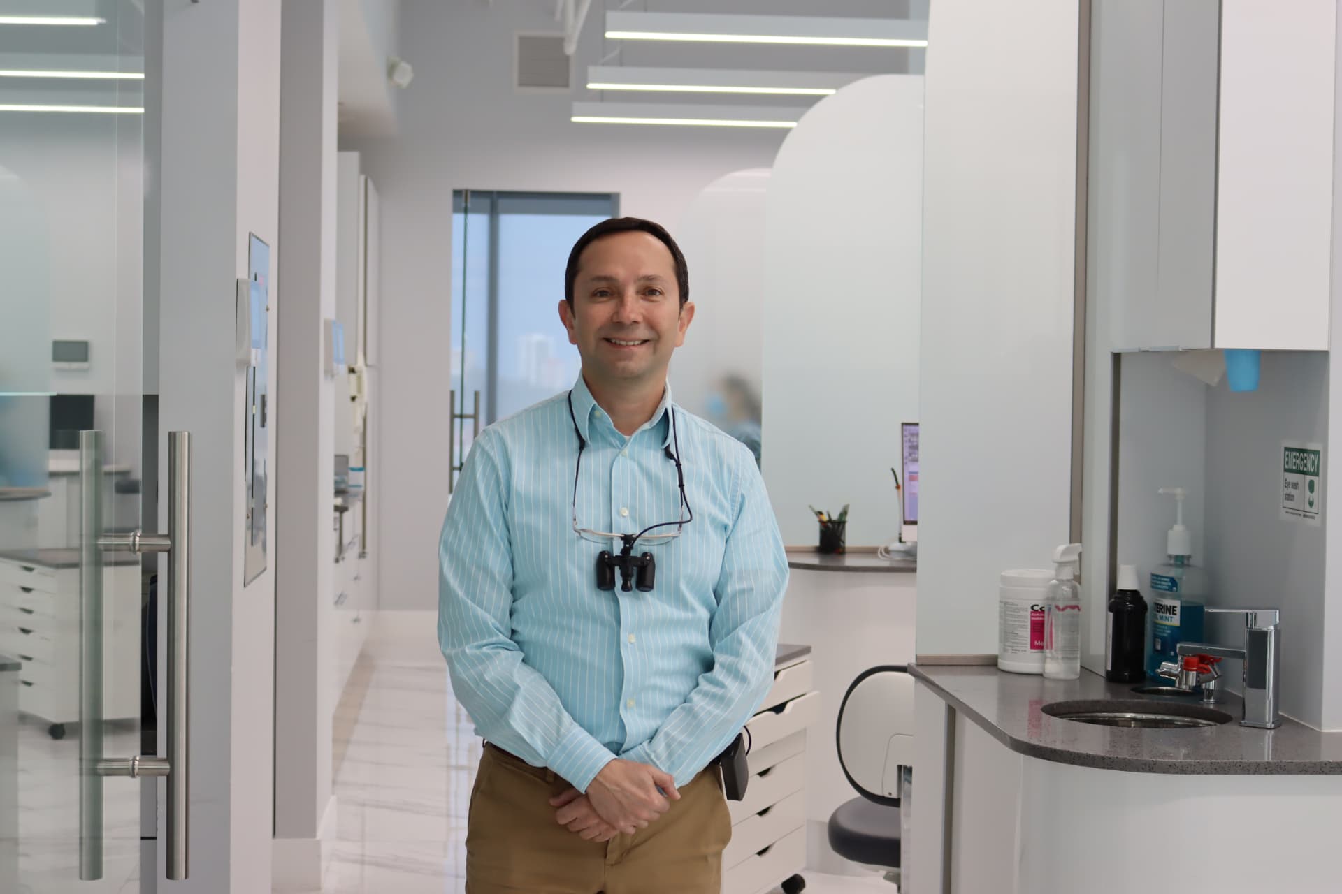 Dr. Victor Dongo standing in Beacon Dental's modern clinical suite
